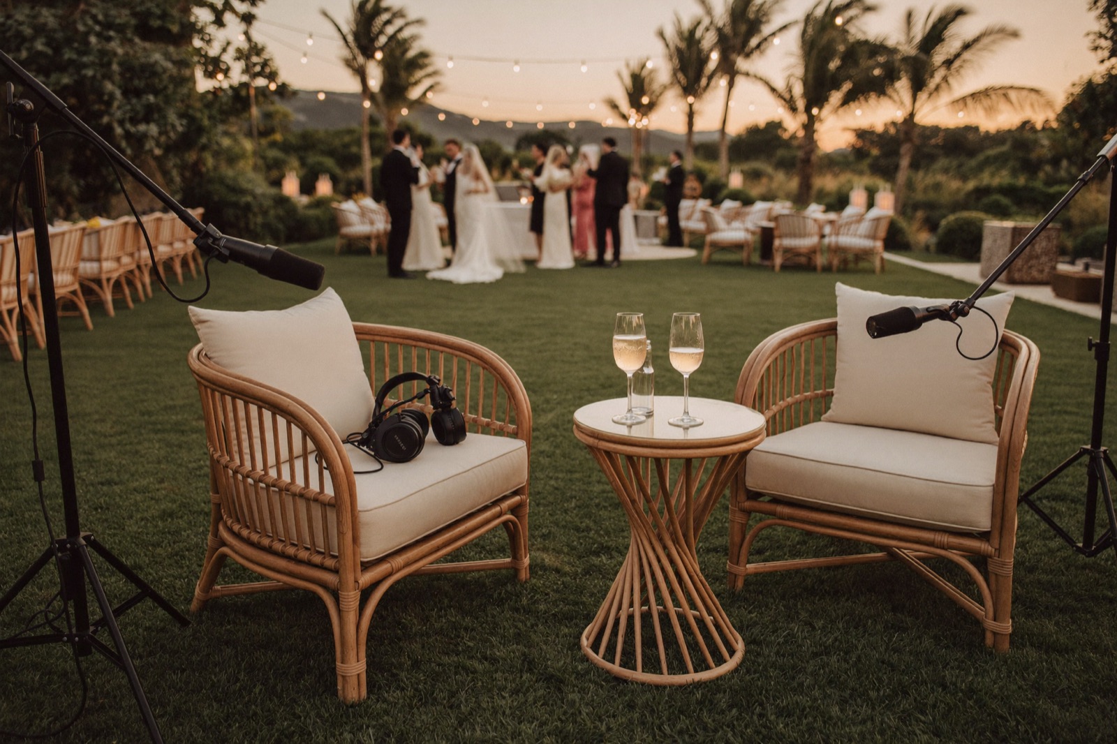 Outdoor podcast set on a tropical garden terrace at golden hour